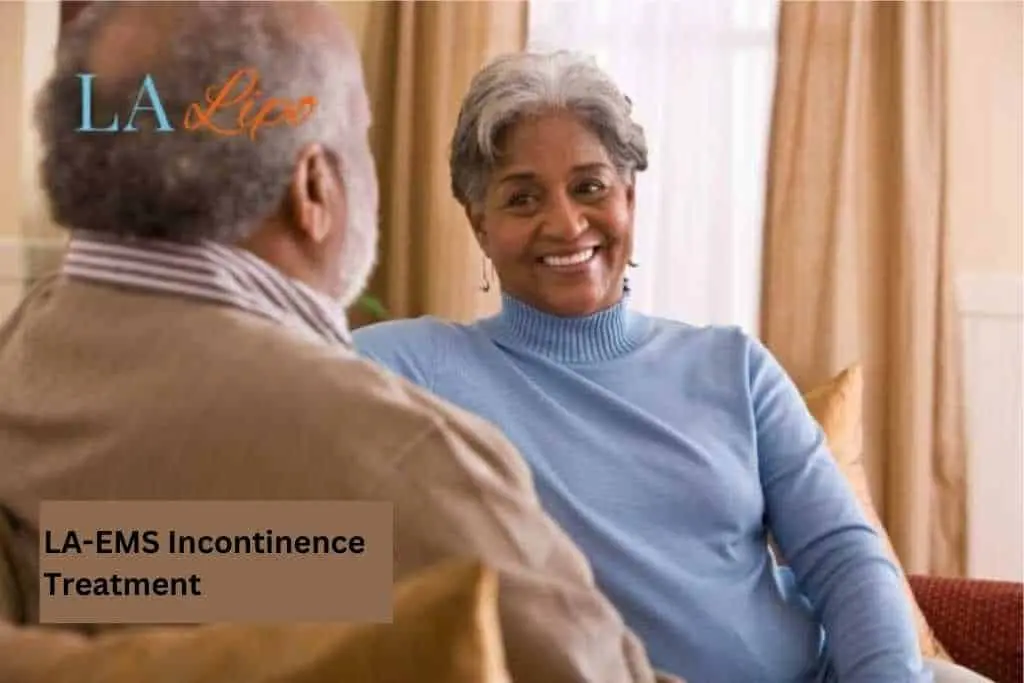 Couple sat smiling at each other - LA-EMS treatment Leicester