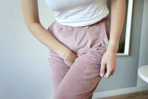 woman running for the toilet because of urinary incontinence Leicester